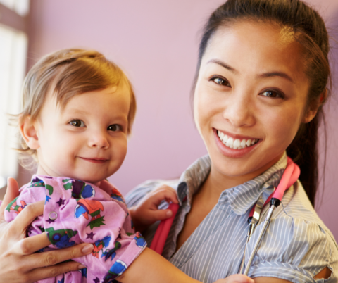 Pediatric cna holding a child